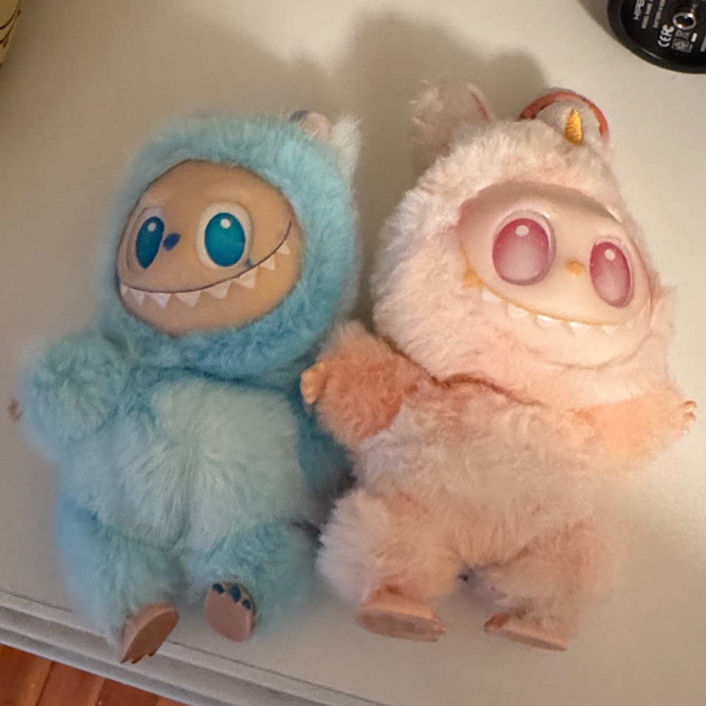 Adorable Blue and Pink Plush Monsters